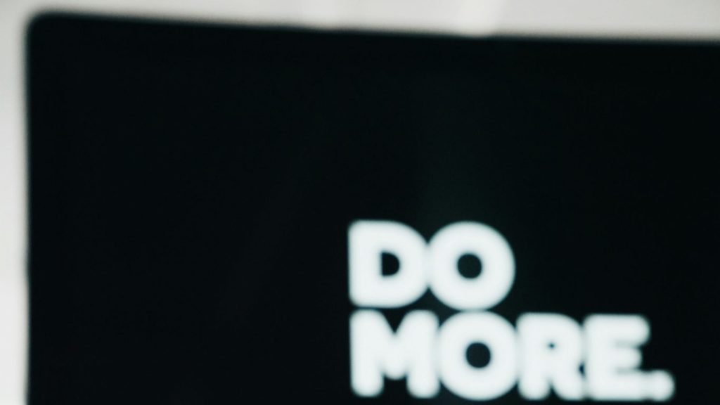 close up photography of black and white ceramic mug on table