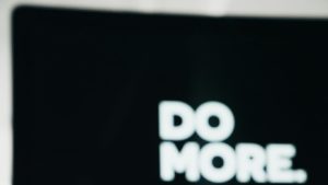 close up photography of black and white ceramic mug on table