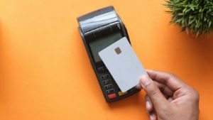 person holding black and white electronic device