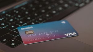 blue and white visa card on silver laptop computer
